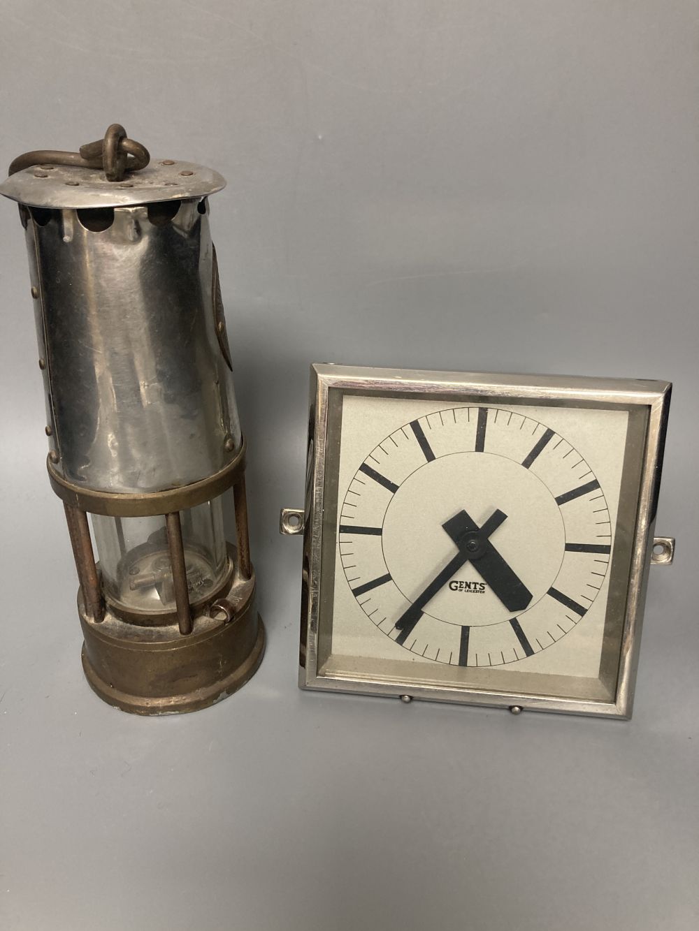 A 1930s Gents of Leicester mantel clock and a Miners lamp by Eccles, 24cm